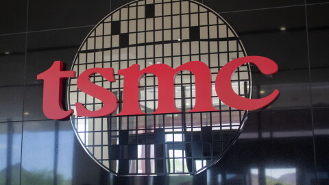 TSMC's logo, which consists of its lowercase letters in red and behind it is a circle made up of rectangular mirrors.