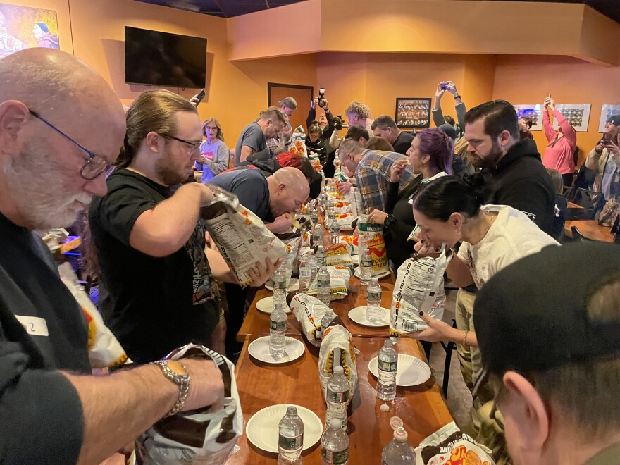 Contestants have five minutes to eat as many Middleswarth potato chips as they can during the Middleswarth Potato Chip Eating Contest, a 10-year tradition in Luzerne County held on the Saturday after Thanksgiving. The 2025 contest drew 28 contestants to Sabatini’s Bar and Bottle Shop in Exeter.