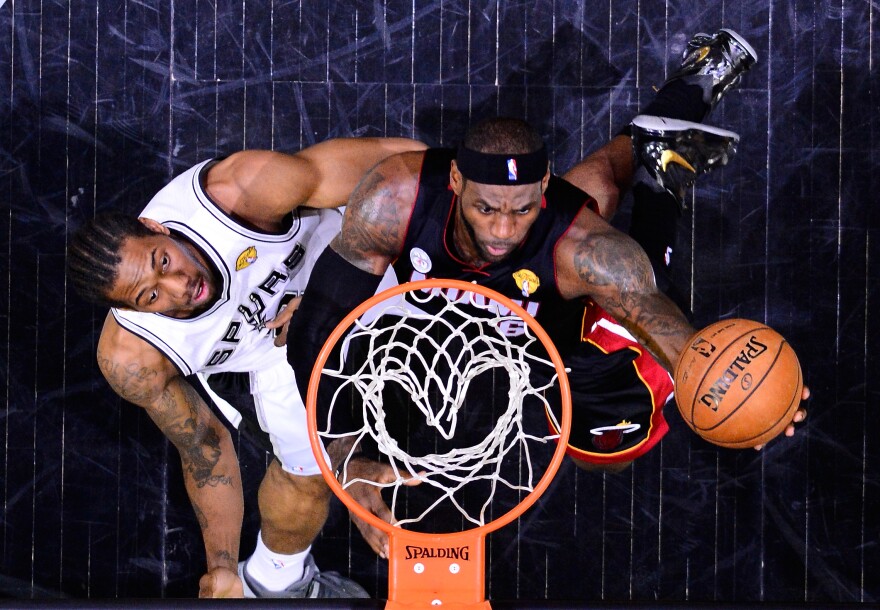 LeBron James of the Miami Heat goes up for a shot against Kawhi Leonard of the San Antonio Spurs during Game 4 of the NBA Finals at the AT&T Center in San Antonio on Thursday.