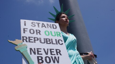 Close up of the woman in the statue of liberty costume.