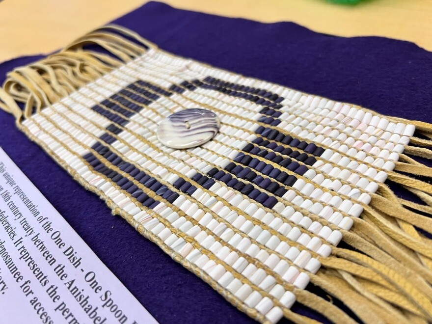 The Onondaga Nation gifted SUNY ESF this newly woven reproduction of the One Dish, One Spoon belt, made by Richard Hamell from native whelk and quahog shell beads, as a gesture of respect and a teaching tool honoring a roughly 1700 peace agreement between the Haudenosaunee and Anishinaabe.