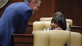 Sen. Greg Leding speaks to Sen. Linda Chesterfield prior to the start of a committee meeting on Feb. 22, 2023.