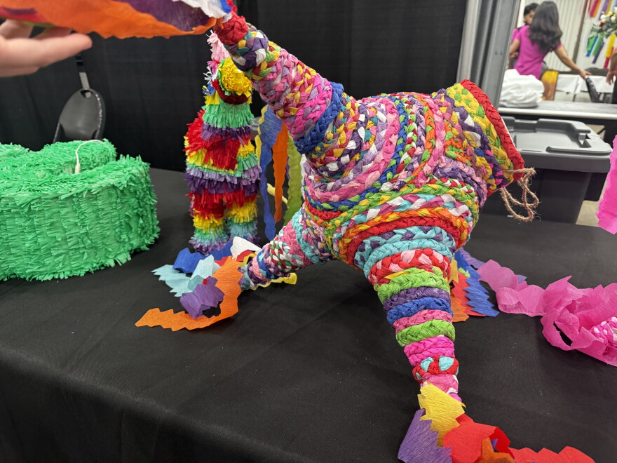Piñata, an object in the shape of an animal, etc. that contains sweets.
