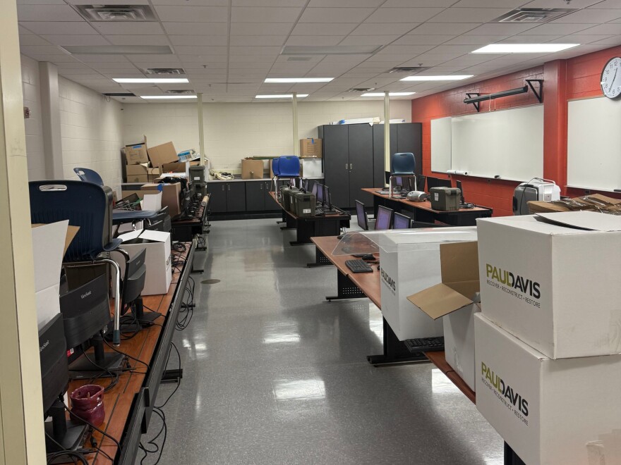Boxes provided by the restoration company sit inside a classroom at Riverside University High School in Milwaukee ahead of the 2026-27 school year. Just one year ago the entire floor was flooded due to heavy rains.
