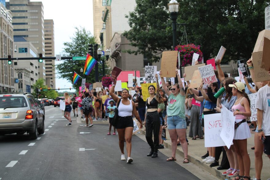 Abortion-rights supporters chant their objections at the Kentucky Capitol in Frankfort on April 13, as state lawmakers debate overriding the governor's veto of an abortion measure.