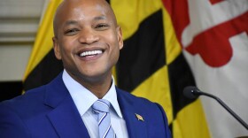 Maryland Gov. Wes Moore smiles after signing executive orders updating ethics policies for his administration and creating a new state department of community service and civic engagement, on his first full day as governor on Thursday.