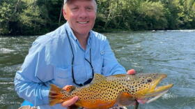 Professor Keith Gido holding a beautiful brown trout