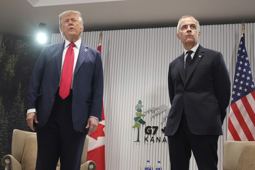 President Donald Trump, left, speaks during a meeting with Canada's Prime Minister Mark Carney on the sidelines of the G7 Summit, Monday, June 16, 2025, in Kananaskis, Canada.