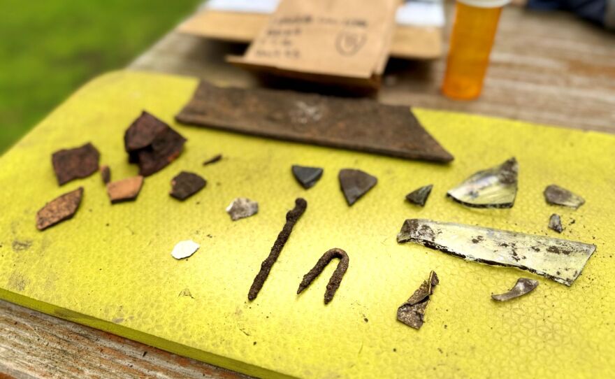 A rusty nail, pottery fragments and broken glass are among the artifacts uncovered during the archaeological dig at the Abbie Gardner Cabin. Researchers believe the items date from about 1891 to 1921.