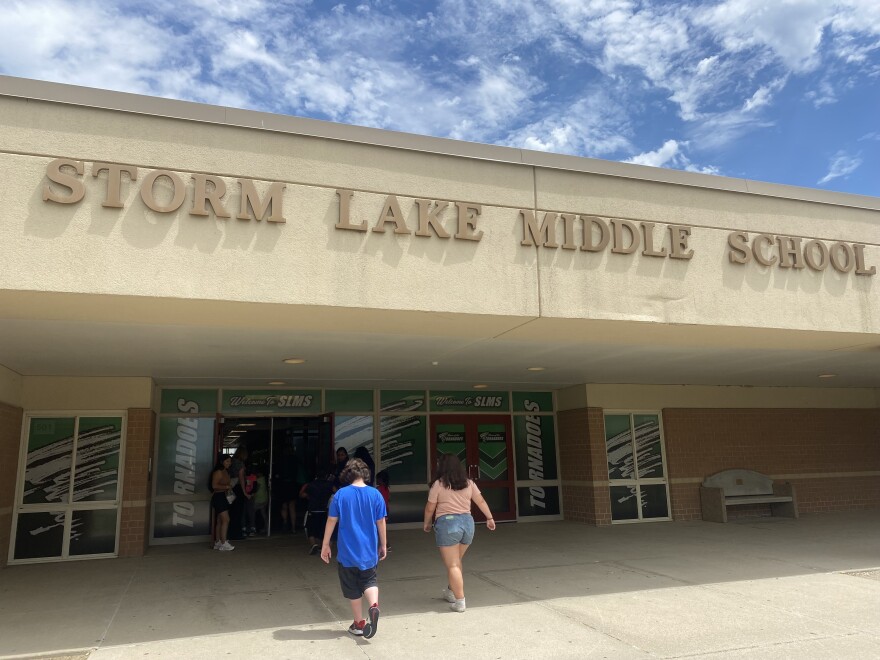 students walk into storm lake middle school