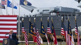 With the USS Battleship North Carolina in the background, President Donald Trump speaks during an event to designate Wilmington as the first American World War II Heritage City, Wednesday, Sept. 2, 2020, in Wilmington, N.C. 