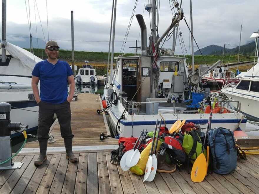 Greg Taylor waits for a boat ride. (Courtesy Alaska Treasure Hunters)