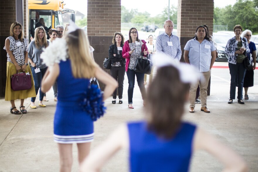 Cheerleaders greet the realtors at Bailey Middle School. 