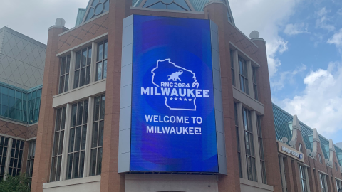 Welcome to Milwaukee sign for the RNC displays on a digital screen at the Baird Center.