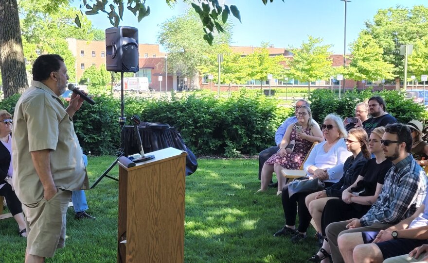 WEMU's Michael Jewett speaks at the dedication of the Lisa Barry memorial garden.