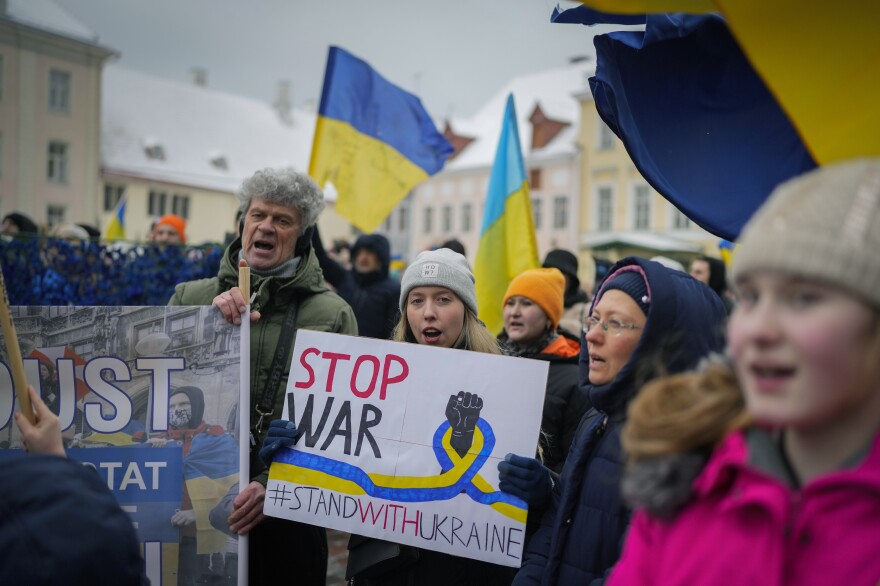 Ukrainians sing a song during a demonstration marking the first anniversary of the Russian invasion of Ukraine, in Tallinn, Estonia, Feb. 25.