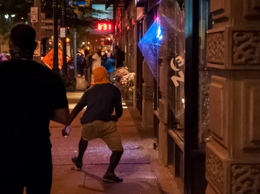 St. Louis police officer Luther Hall says he was monitoring individuals breaking windows, as seen in this photo from Sept. 17, 2017, when he was beaten by fellow officers during a mass arrest.