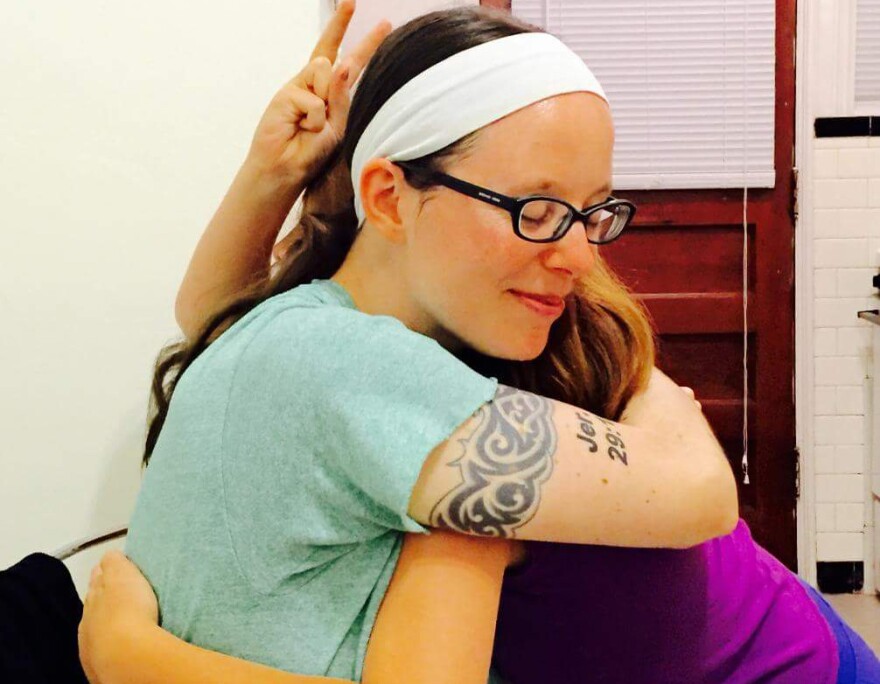 Valéria Souza, 36, hugs her step-daughter in a family photo. 