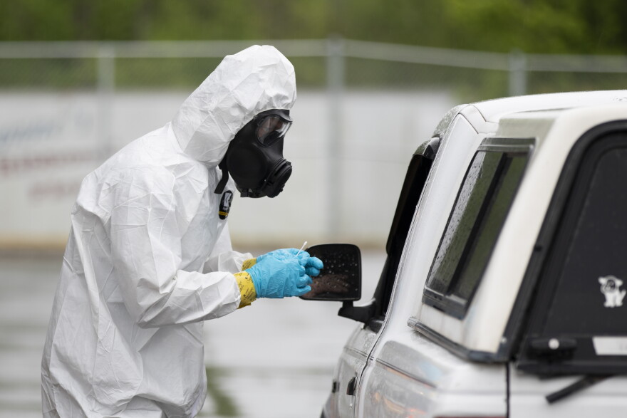 File photo of a North Carolina National Guard soldier with the 42nd Civil Support Team conducting drive-thru and walk-up COVID-19 testing in Chatham County on April 23, 2020.