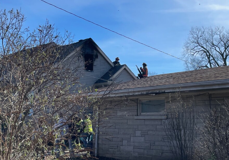 Evansville firefighters on the roof of a home that burned in the unit block of Taylor Avenue Tuesday, Dec. 30, 2025