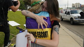 Derenda Hancock, co-director of the Jackson Women's Health Organization clinic patient escorts, better known as the Pink House defenders, left, hugs a tearful abortion rights supporter Sonnie Bane, outside the Jackson Women's Health Organization clinic in Jackson, Miss., Wednesday, July 6, 2022. The clinic is the only facility that performs abortions in the state. However, on Tuesday, a chancery judge rejected a request by the clinic to temporarily block a state law banning most abortions. Without other developments in the Mississippi lawsuit, the clinic will close at the end of business Wednesday and the state law will take effect Thursday. (AP Photo/Rogelio V. Solis)