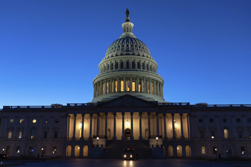 The U.S. Capitol is seen on a sunset a day before the House prepares to vote on a bill to reopen the government at the Capitol in Washington, Tuesday, Nov. 11, 2025.