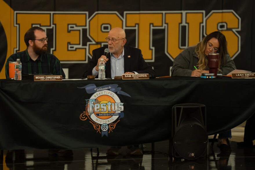 From left: Festus Public Works Director Michael Cristopher, Mayor Sam Richards, and Clerk Leah Smith lead a meeting to approve a plan to develop a large-scale data center in the community on Monday night at Festus High School.