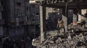 Palestinians check a house destroyed in the Israeli bombardment on Rafah, Gaza Strip, Monday, Dec. 11, 2023. (Fatima Shbair/AP)