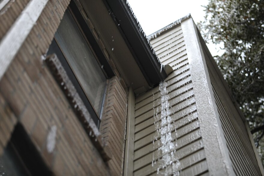 Icicles hang from the roof of an apartment complex without power in the Windsor Park neighborhood of Austin on Feb. 17. 