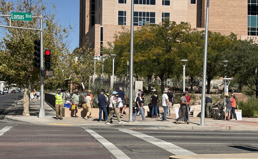 Members of Indivisible ABQ held signs encouraging motorists to vote early on Lomas Ave on Wednesday October 7, 2026.