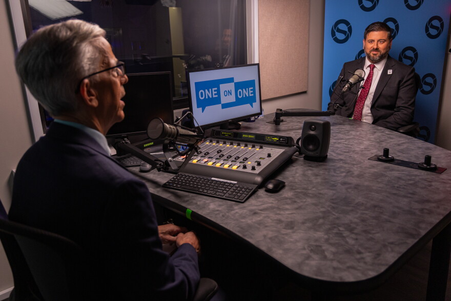 RIPTA CEO Christopher Durand speaks with Ocean State Media political reporter Ian Donnis. Credit: Michael Frank/Ocean State Media