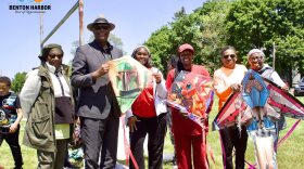 Mayor Marcus Muhammad and First Lady Abisayo Muhammad pose with participants holding kites during last year’s Benton Harbor kite flying event.