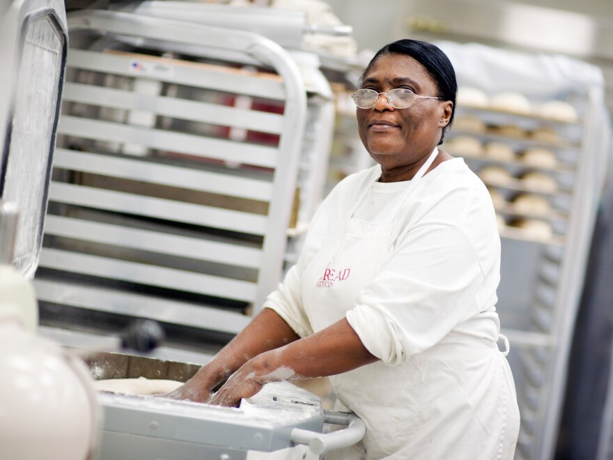 Hot Bread Kitchen graduate and product coordinator Marie Poisson divides focaccia dough.