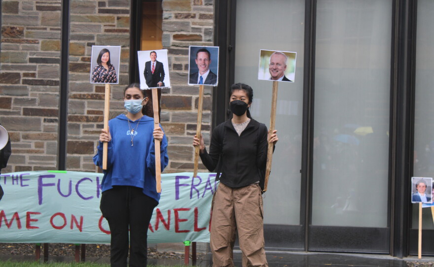 Protesters gathered in a courtyard outside the meeting of the Cornell Board of Trustees on Friday.