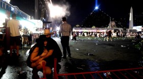 People take cover at the Route 91 Harvest country music festival after gunfire was heard on Oct. 1, 2017 in Las Vegas, Nev. (David Becker/Getty Images)