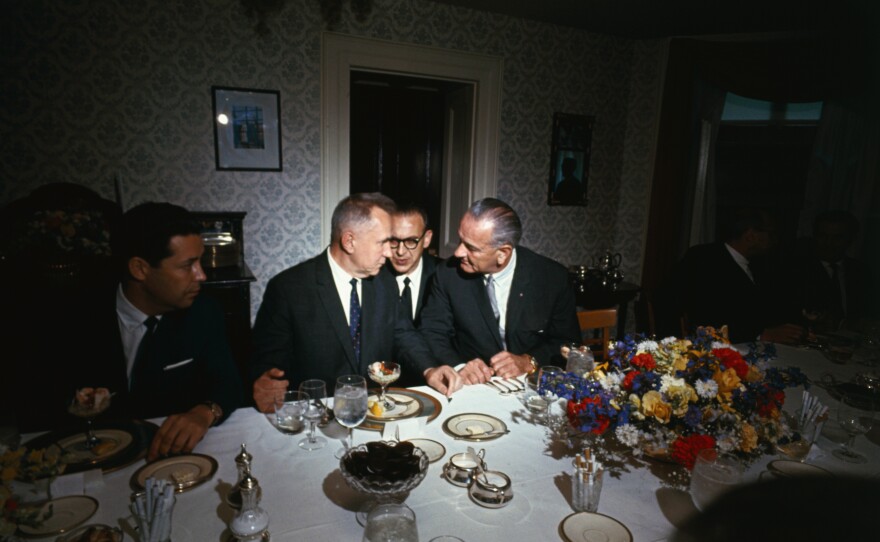 Soviet Premier Aleksei Kosygin (left) and President Lyndon B. Johnson confer during a luncheon at what was then known as Glassboro State College in New Jersey in 1967. An interpreter sits between them.