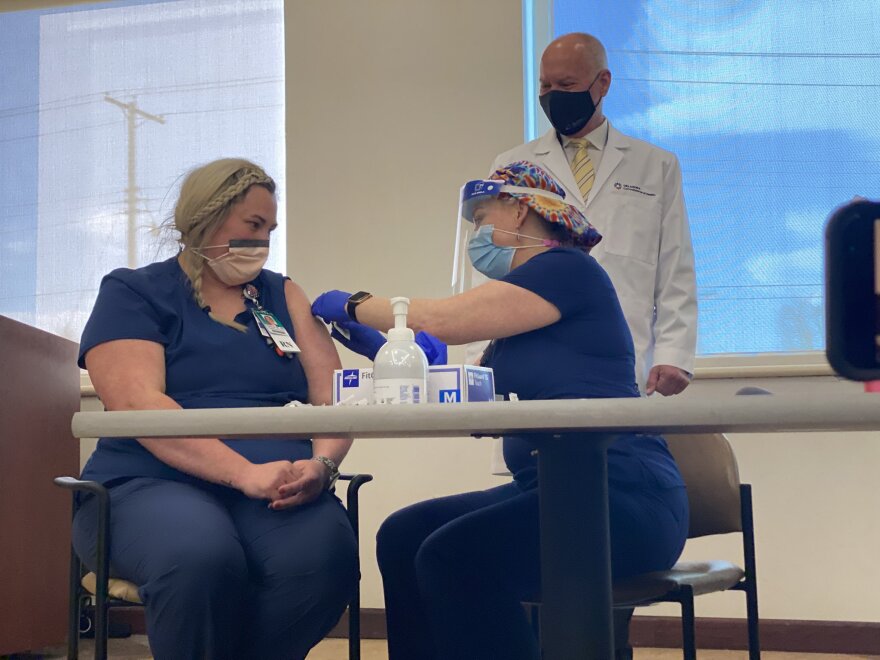 NTEGRIS Health registered nurse Hannah White getting the state's first official dose of coronavirus vaccine.