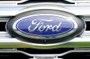 FILE - A logo on a vehicle at a Ford dealership in Springfield, Pa., Tuesday, April 26, 2022. (AP Photo/Matt Rourke, File)