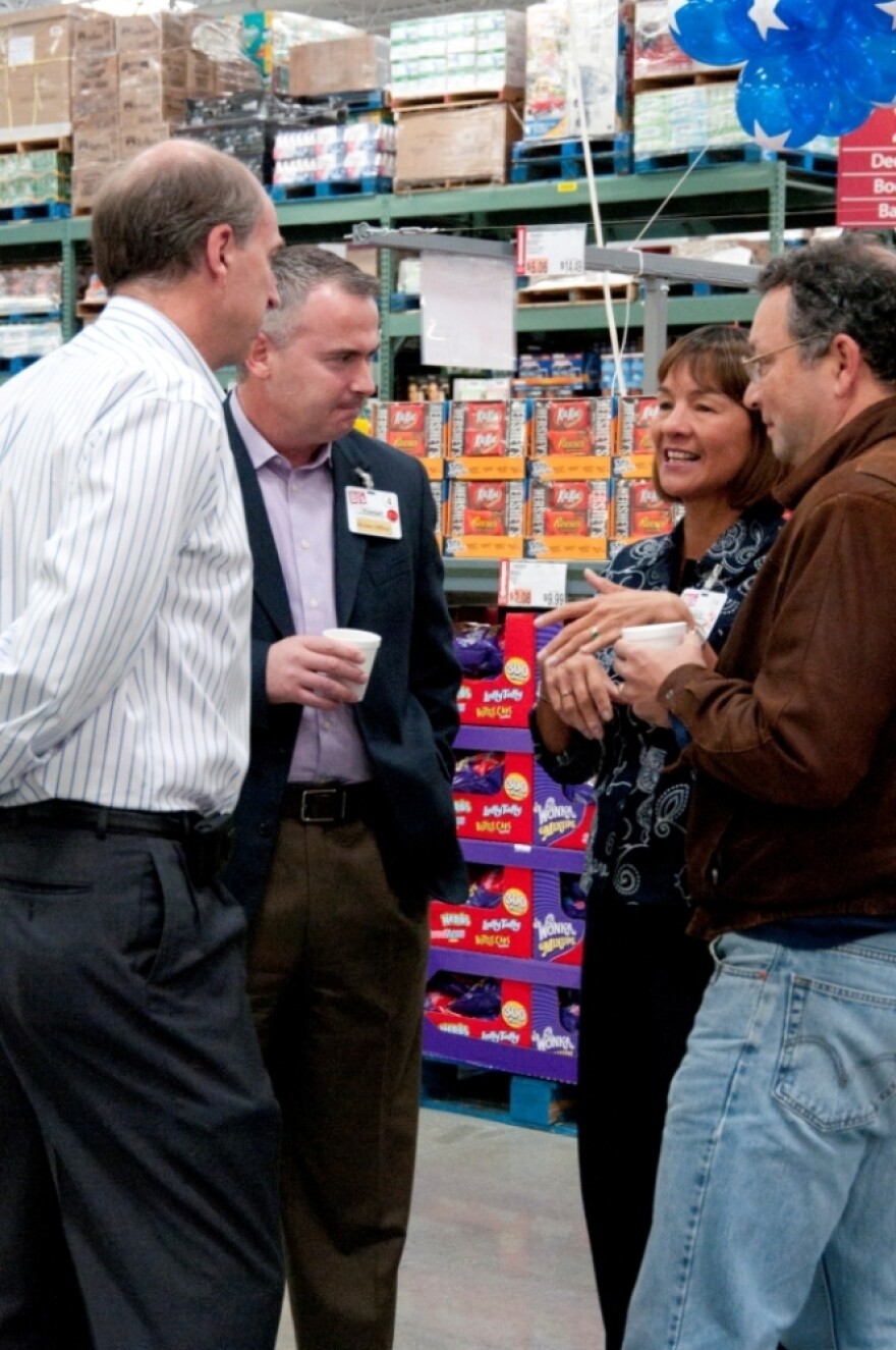 Laura Sen talks with team members at the opening of the Northborough, Mass., club in September 2011.