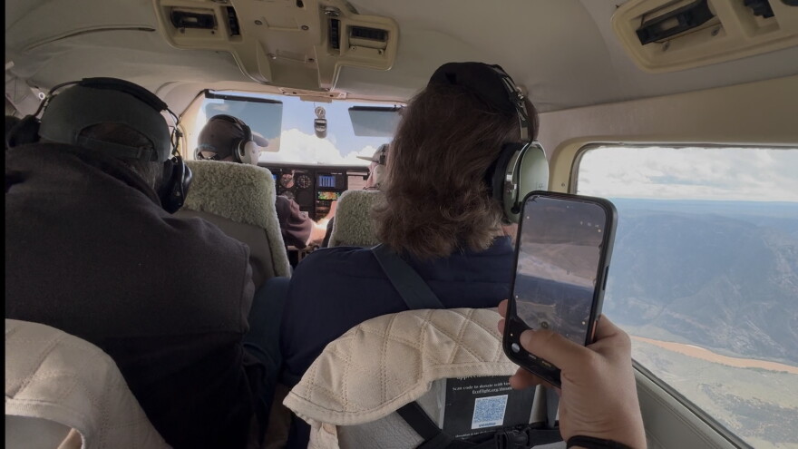 Four people in a plane.