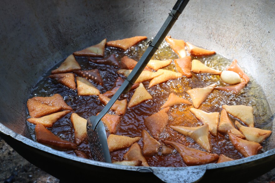 Fried dough is deep fried in a metal kazan to make