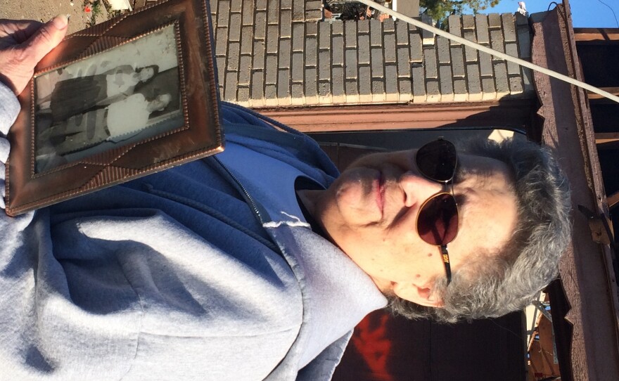 Moore resident Joetta Strain holds her "prized possession," a photograph of her parents she's had since she was 16. The home she's lived in since 1973 is likely a total loss after Wednesday's tornado.