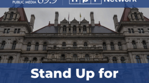 Stand Up for Public Media. WRVO and NPR Network logos above the New York State Capitol building.