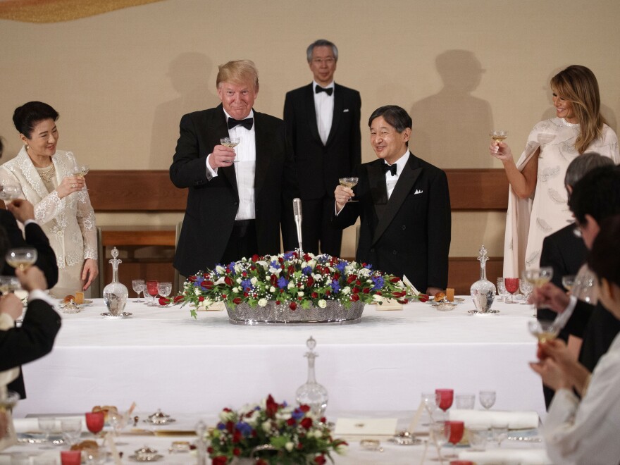 President Trump and First Lady Melania Trump attend a state banquet with Japanese Emperor Naruhito (second from right), and Empress Masako (left) on Monday in Tokyo.