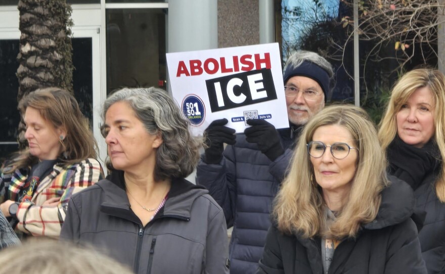 People gather at a vigil on Sunday, January 18, 2026, in front of Orlando City Hall, acknowledging the immigrant communities facing potential detention and deportation.