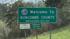 A sign welcomes travelers to Buncombe County.