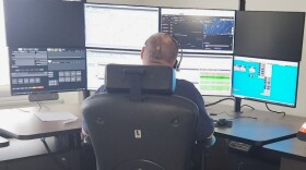 Oneida County 911 dispatcher works with AI-powered technology to improve call processing.