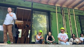 Adam Hopfner, director of the Yale School of Architecture’s Jim Vlock First Year Building Project, speaking among his program students on the site of the second house built by Yale students for the Friends Center for Children teacher housing in New Haven, Connecticut on July 15th, 2024.