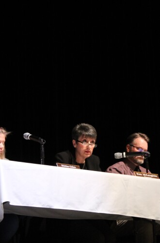 Acting School Board Chair Kim McLaughlin speaks at the Hibbing School Board meeting March 30, 2026, in the high school auditorium.