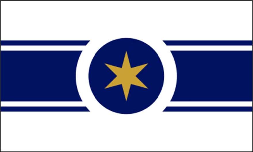 Relationship to Illinois: I’ve lived here for nearly 10 years and have grown to love this state. It’s an excellent place to settle down, with welcoming people who have always made me feel at home. From stunning city views to beautiful countryside, my appreciation for this state has deepened. Explain the meaning behind your flag: A large gold star in the center draws attention, much like the standout features of our state. Gold color symbolizes out the richness in our state, people, land and views. A horizontal blue line symbolizes lake Michigan, separating the sky from the rich land. Two smaller lines add a neat, elegant touch. The central circle abstractly represents the view from above Abraham Lincoln’s hat.
